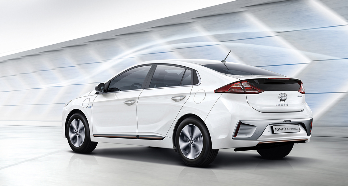 Side rear view of white Ioniq electric with aerodynamic design